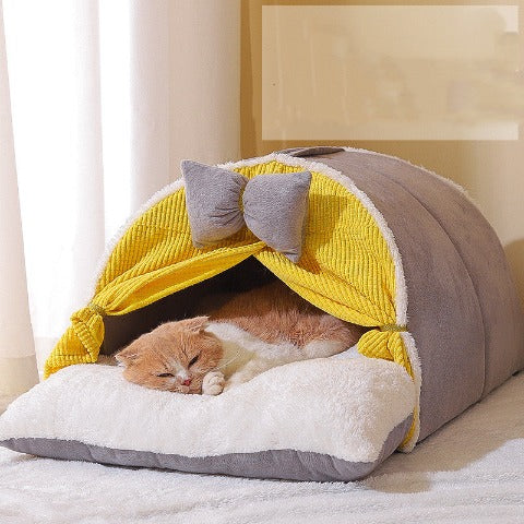 A cat sleeping in a milky yellow cat cocoon