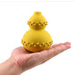 Yellow Treat Dispenser Toy on a hand 