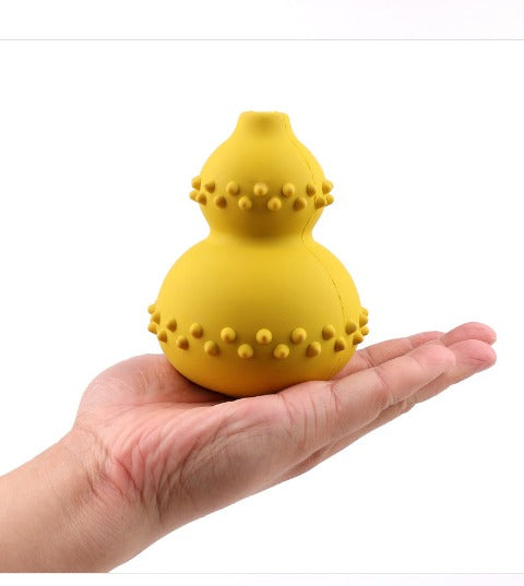 Yellow Treat Dispenser Toy on a hand 