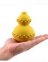 Yellow Treat Dispenser Toy on a hand 