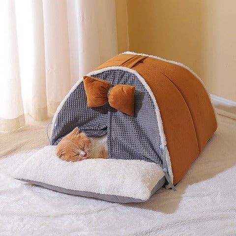 A cat sleeping in a coffee-colored comfy cat cocoon