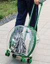 A person using a green Cat carrier on wheels as a suitcase