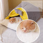 A cat sleeping in a milky yellow cozy cat cocoon