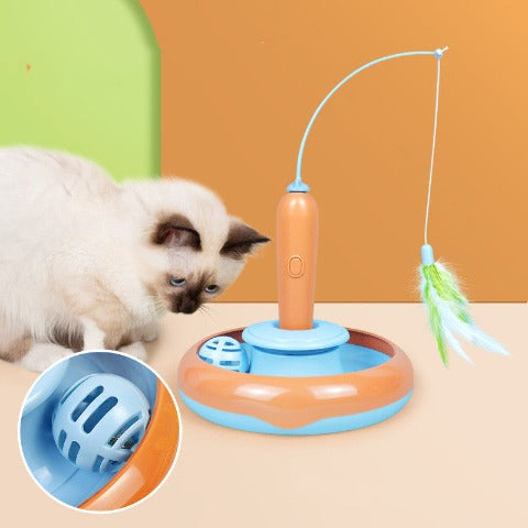 An orange-blue Cat Fishing Toy with a blue ball in a hollow. A cat is looking at the ball