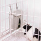 Guinea pig eating from a grey Guinea Pig Feed Bag in a cage