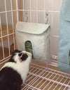 Guinea pig smelling a Pet Food Bag in a cage